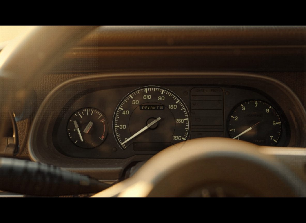 inner-1 — Close-up of Toyota Land Cruiser safari vehicle fuel gauge and dashboard interior — alt: