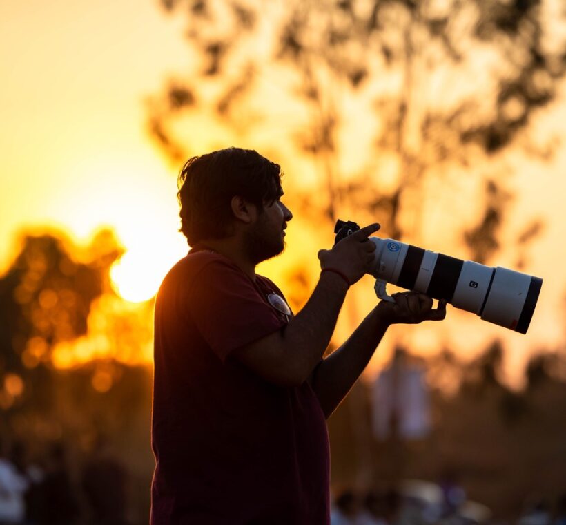 best kenya safari for photographers - wildlife photographer in open vehicle, Masai Mara
