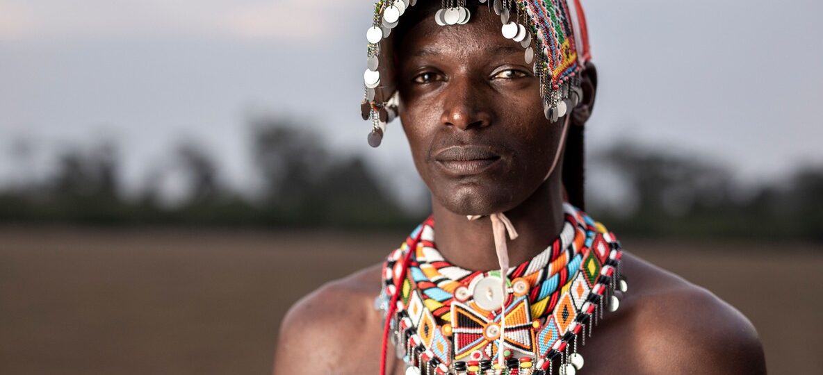 kenya diaspora heritage tour -- parent and child at Maasai Mara at golden hour