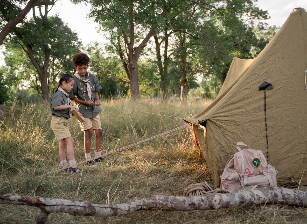Simple canvas safari tent with mosquito netting and a private veranda at a budget Masai Mara camp near Talek Gate