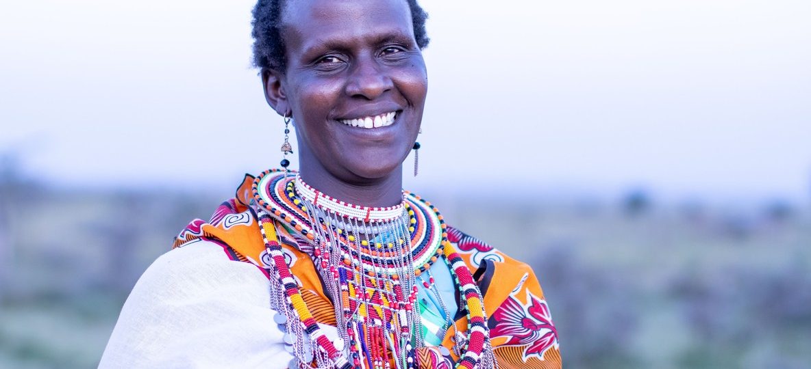 Maasai woman in traditional beaded jewellery representing community conservation in Kenya