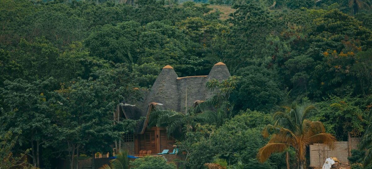 solar panels visible on roof structures, golden morning light, wide landscape shot