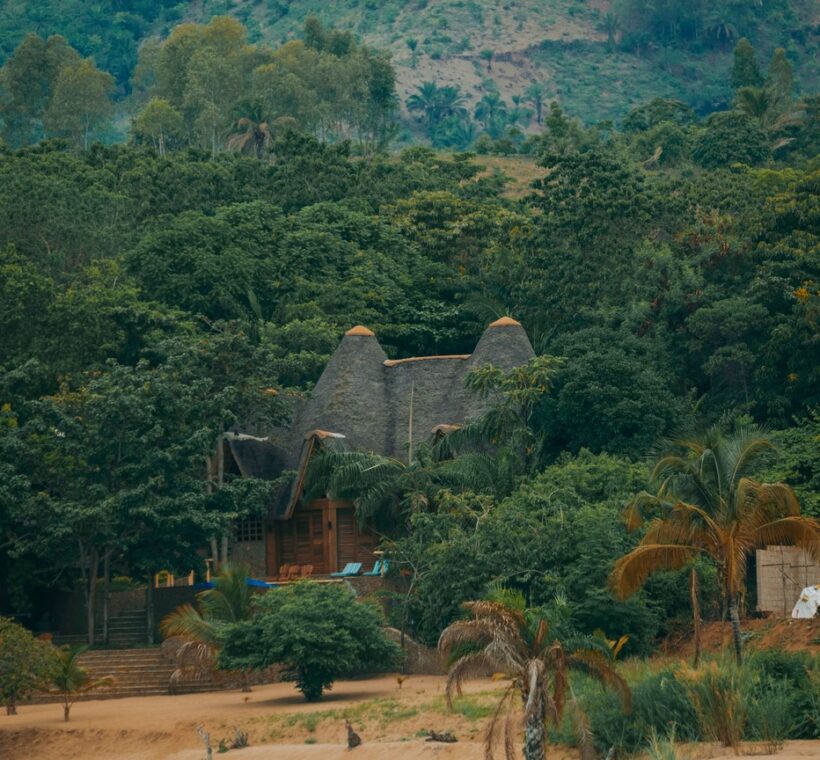 solar panels visible on roof structures, golden morning light, wide landscape shot