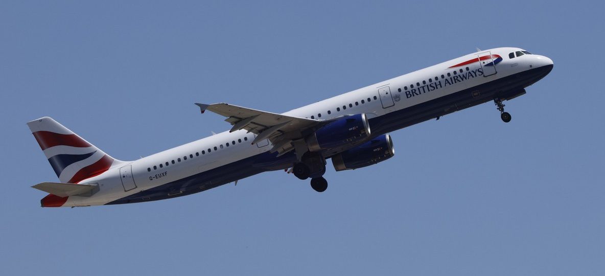 Kenya Airways London Heathrow flight: wide-body long-haul passenger jet climbing after takeoff against a clear sky, representative of the Nairobi to London route