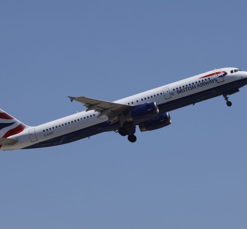 Kenya Airways London Heathrow flight: wide-body long-haul passenger jet climbing after takeoff against a clear sky, representative of the Nairobi to London route