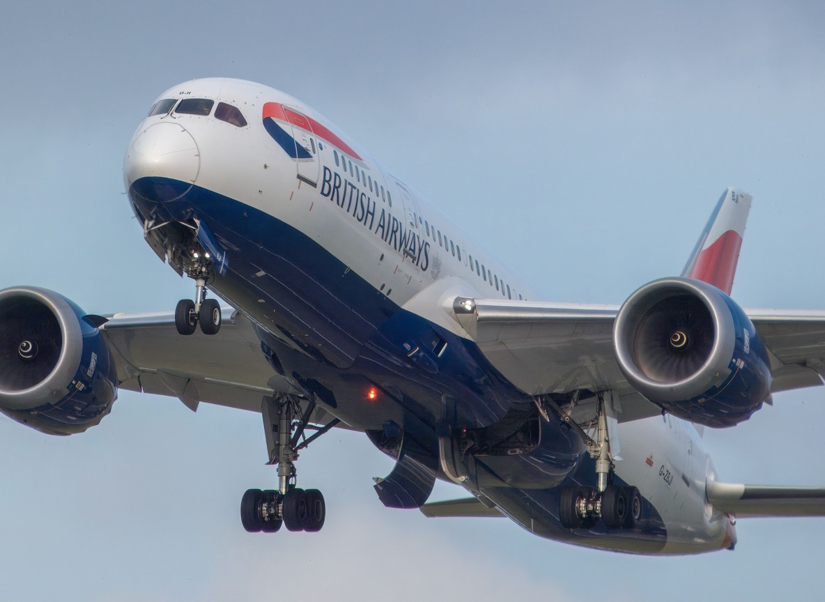 Wide-body aircraft on final approach with landing gear extended, illustrating a long-haul arrival