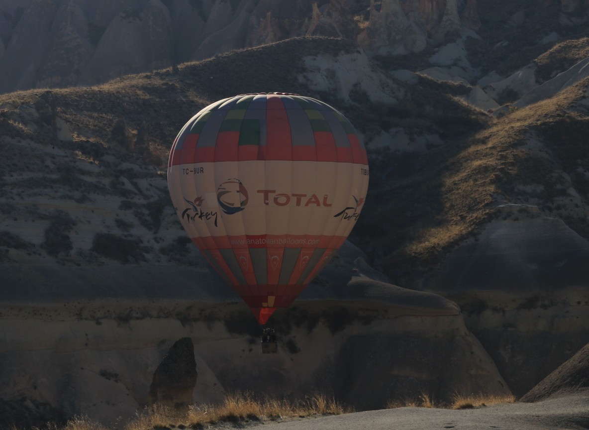 A hot-air balloon drifting over the Kenyan plains at sunrise
