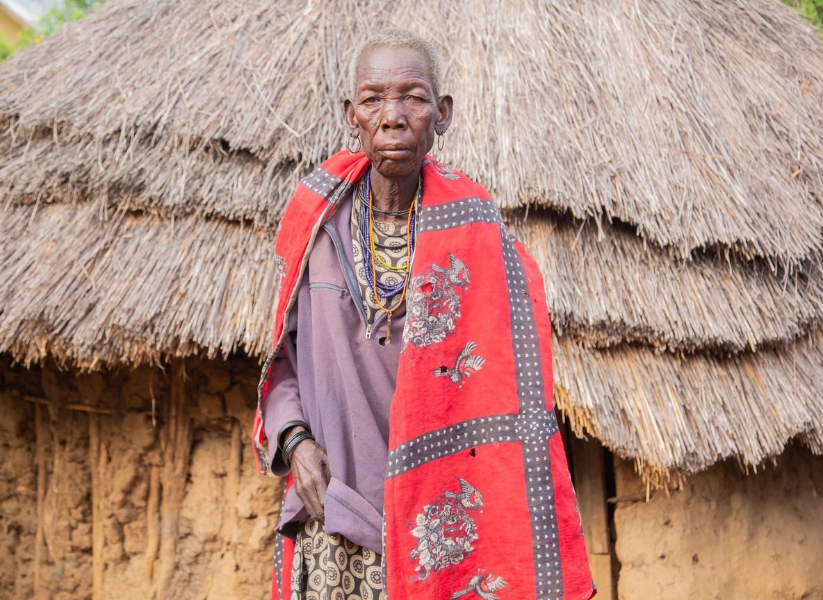 a Samburu elder in traditional beaded ornaments photographed in warm evening light near Samburu Kenya