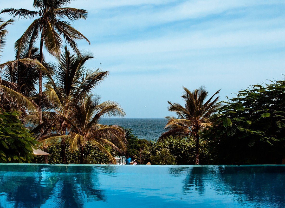 Marine researchers snorkeling near a coral reef restoration site off the Kenyan coast