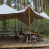 Laikipia Wilderness Camp Kenya open-sided safari tent overlooking the Ewaso Ng'iro River valley at dawn