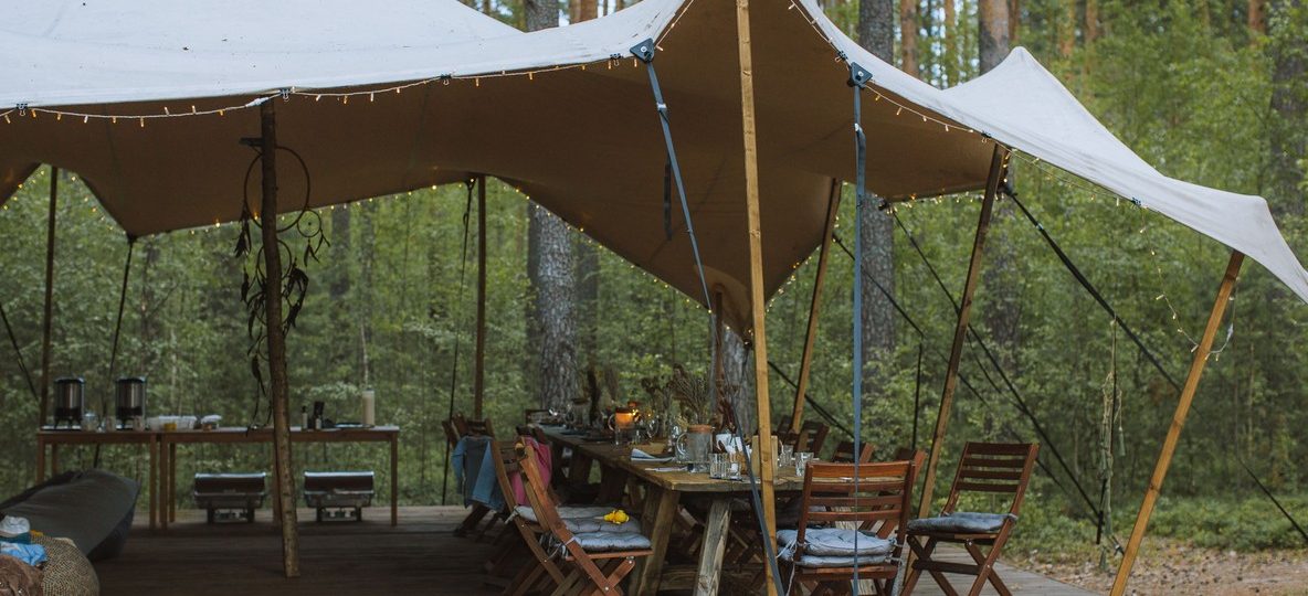 Laikipia Wilderness Camp Kenya open-sided safari tent overlooking the Ewaso Ng'iro River valley at dawn
