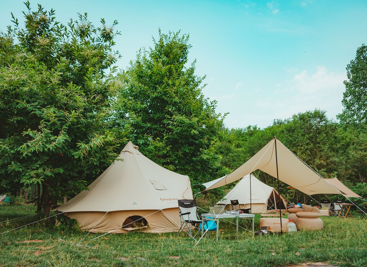 mosquito net, and wooden furnishings at a Masai Mara camp