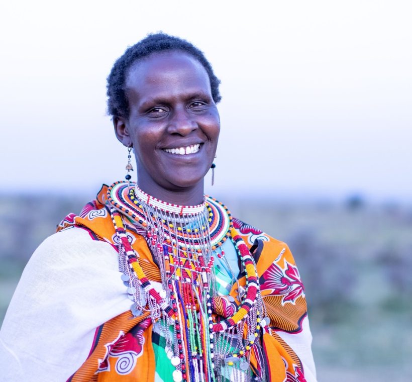 Masai Mara, acacia trees and tented structures